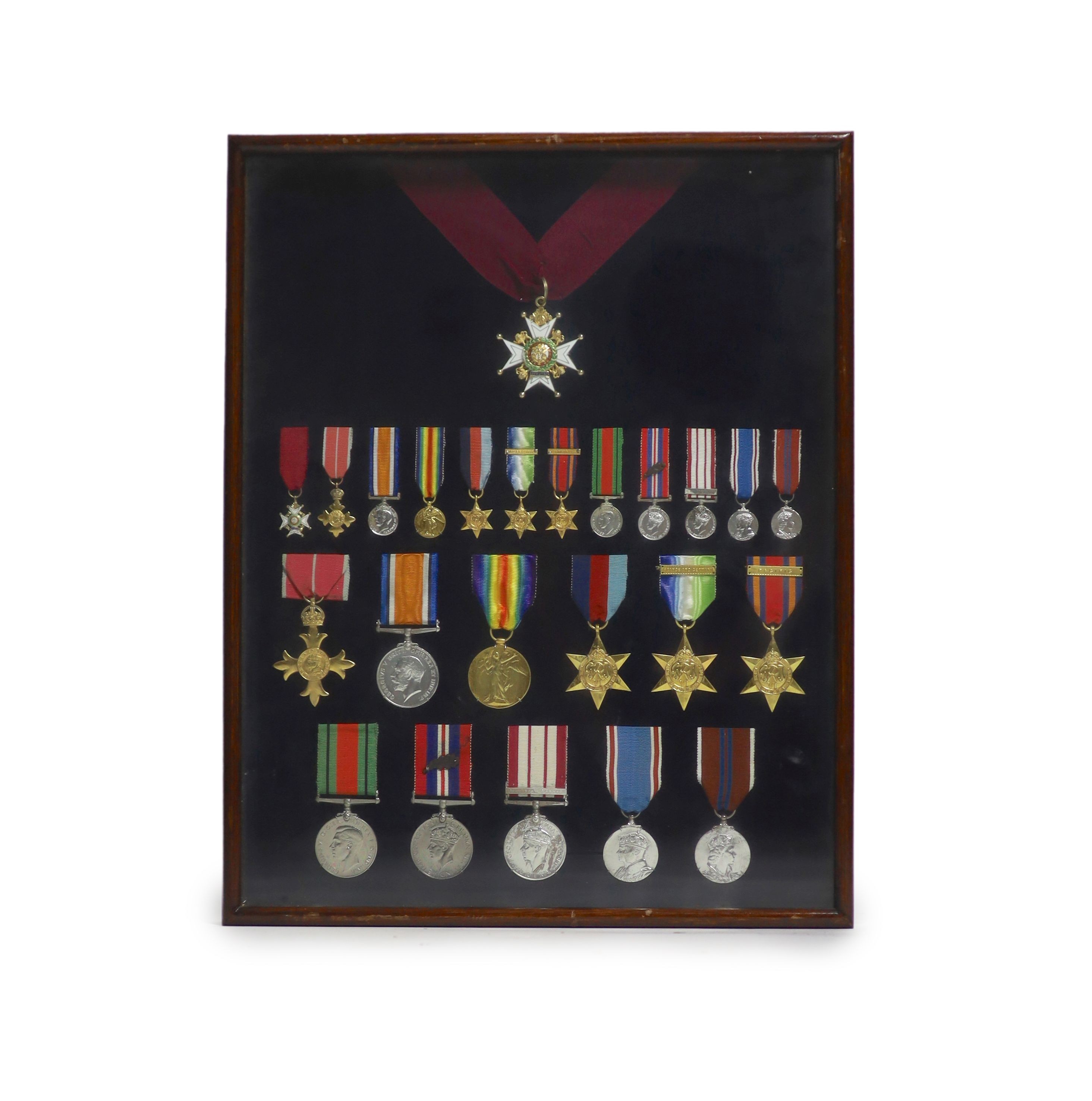 A cased WWI, WWII and Military C.B. medal group to Rear-Admiral John Dent R.N. (1899-1973) and a cased KCVO and Order of St. John to his son Sir Robin John Dent (1929-1999) Case 45.5 x 36 cm